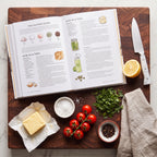 Salt, Fat, Acid, Heat open on a butcher-block board